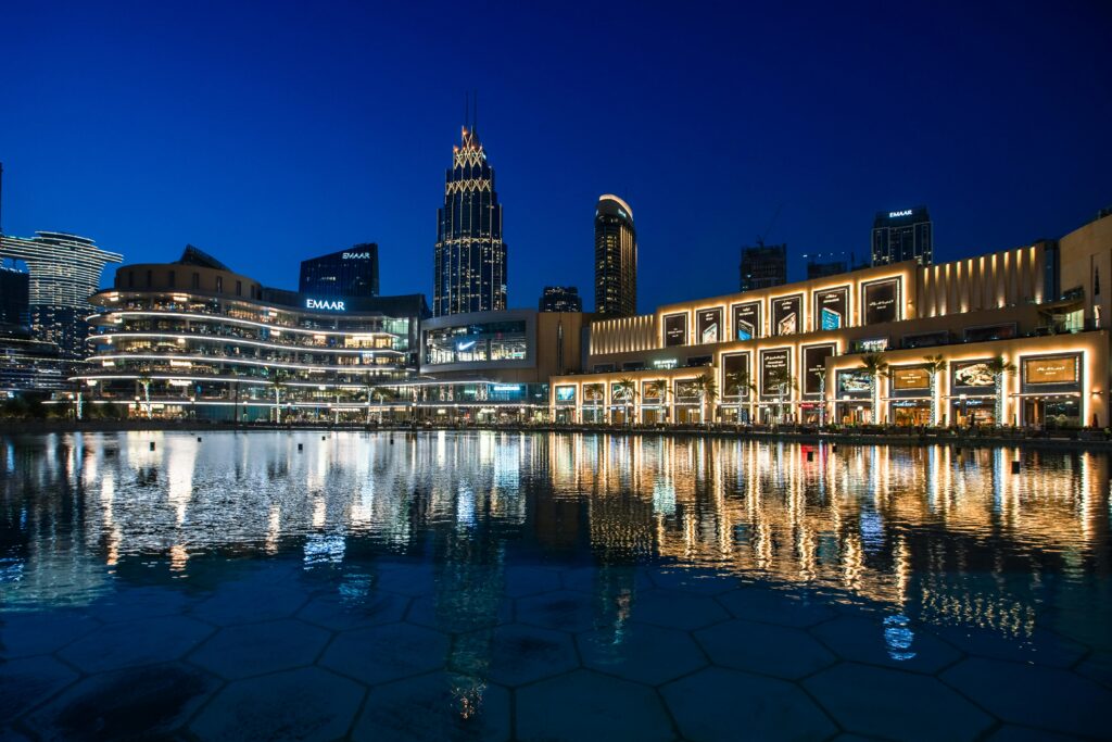 buildings of dubai with sea with sparkling gold and silver lights