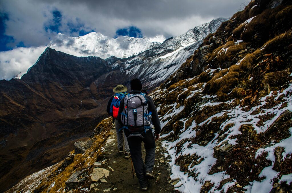 2 people hiking in himalayas