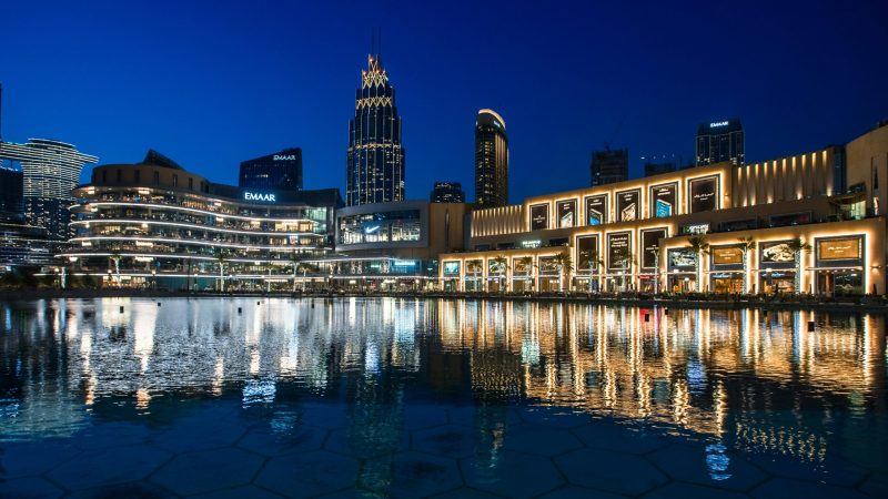 buildings of dubai with sea with sparkling gold and silver lights